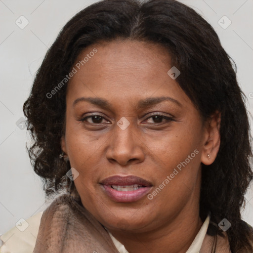 Joyful latino adult female with medium  brown hair and brown eyes