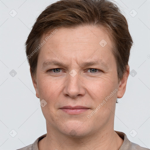 Joyful white adult male with short  brown hair and grey eyes