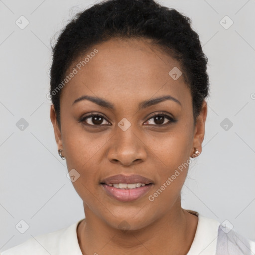 Joyful black young-adult female with short  black hair and brown eyes