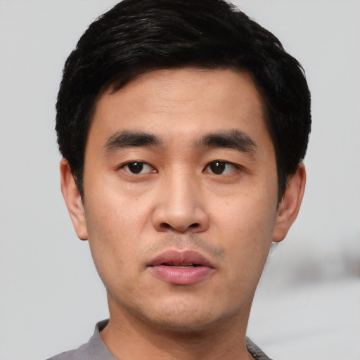 Neutral asian young-adult male with short  black hair and brown eyes