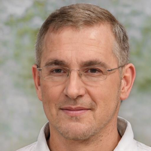 Joyful white middle-aged male with short  brown hair and brown eyes