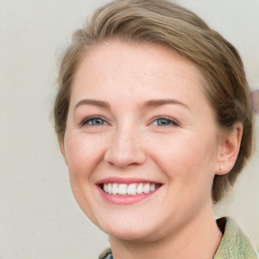 Joyful white young-adult female with medium  brown hair and blue eyes