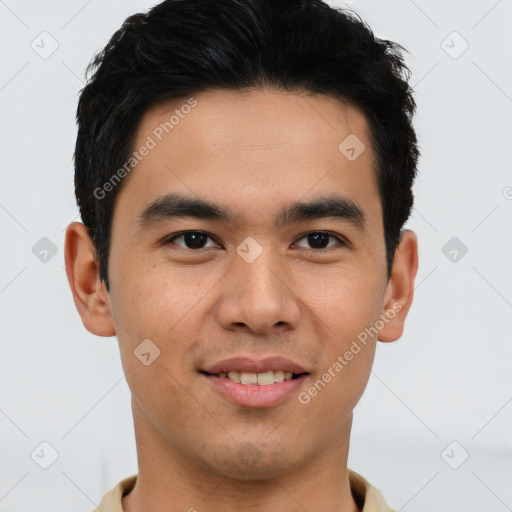 Joyful latino young-adult male with short  brown hair and brown eyes