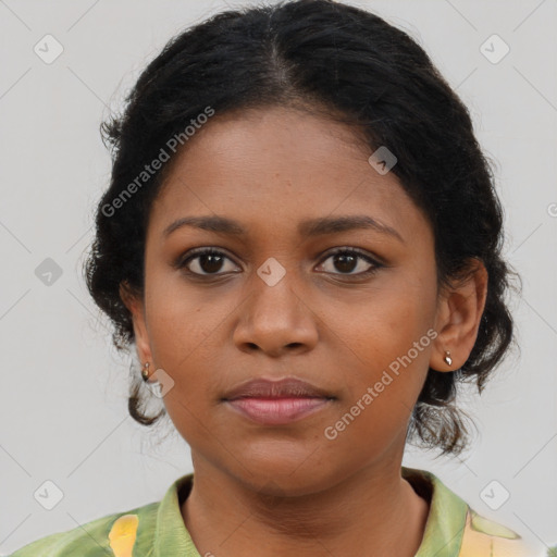 Joyful black young-adult female with medium  brown hair and brown eyes