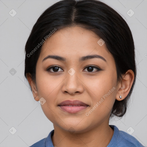 Joyful latino young-adult female with medium  black hair and brown eyes