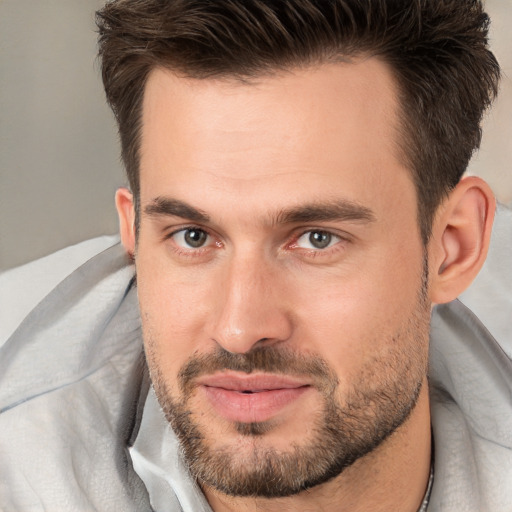 Joyful white adult male with short  brown hair and brown eyes