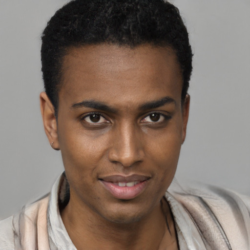 Joyful black young-adult male with short  brown hair and brown eyes