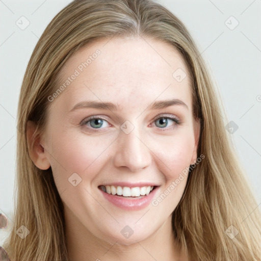 Joyful white young-adult female with long  brown hair and blue eyes