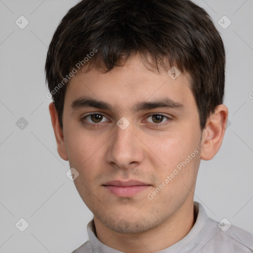 Neutral white young-adult male with short  brown hair and brown eyes