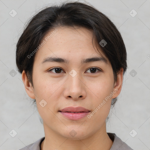 Joyful asian young-adult female with short  brown hair and brown eyes