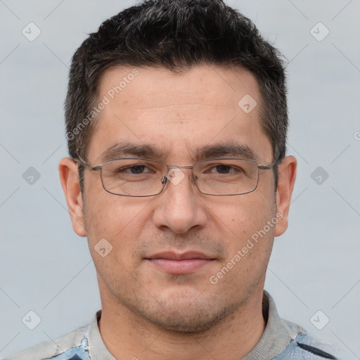 Joyful white adult male with short  brown hair and brown eyes