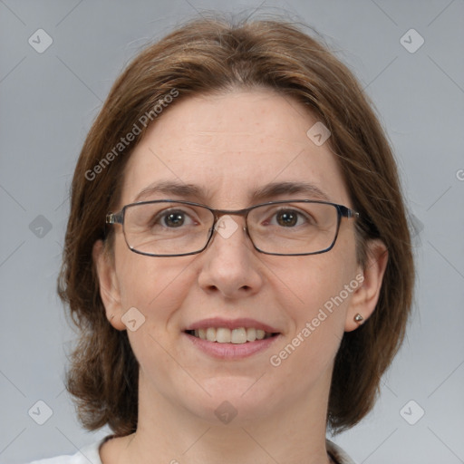 Joyful white adult female with medium  brown hair and grey eyes