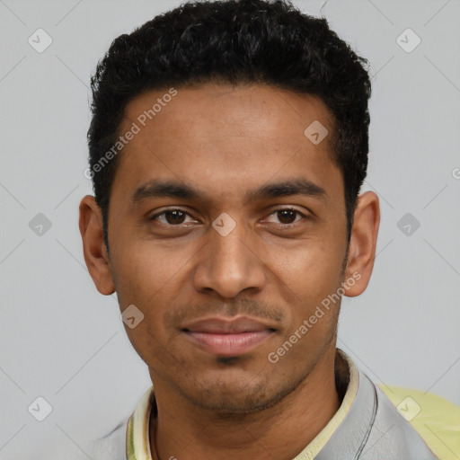 Joyful latino young-adult male with short  black hair and brown eyes