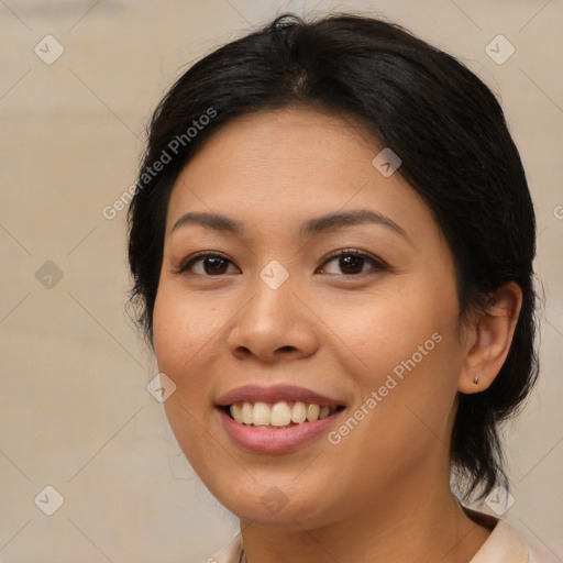 Joyful latino young-adult female with medium  brown hair and brown eyes