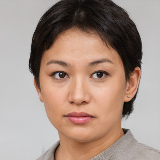 Neutral asian young-adult female with short  brown hair and brown eyes