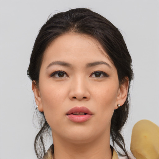 Neutral asian young-adult female with medium  brown hair and brown eyes