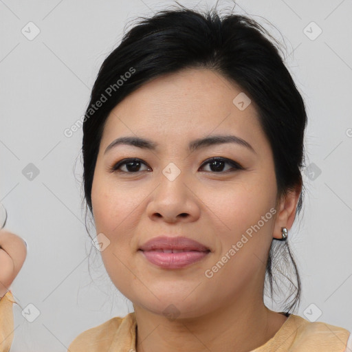 Joyful asian young-adult female with medium  brown hair and brown eyes