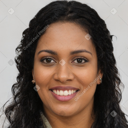 Joyful black young-adult female with long  brown hair and brown eyes