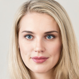 Joyful white young-adult female with long  brown hair and green eyes