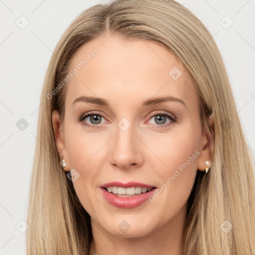 Joyful white young-adult female with long  brown hair and grey eyes