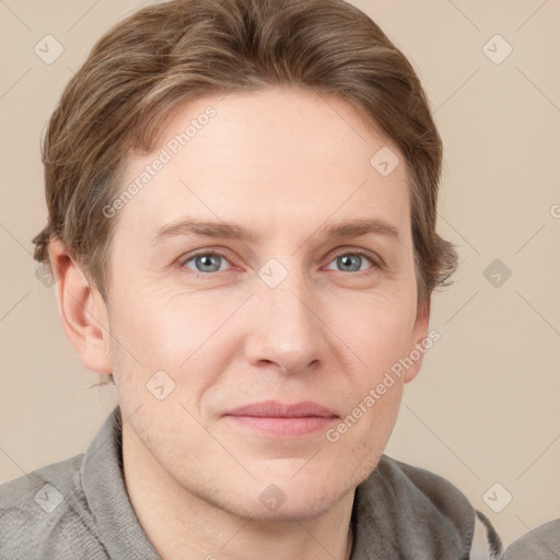 Joyful white adult male with short  brown hair and grey eyes