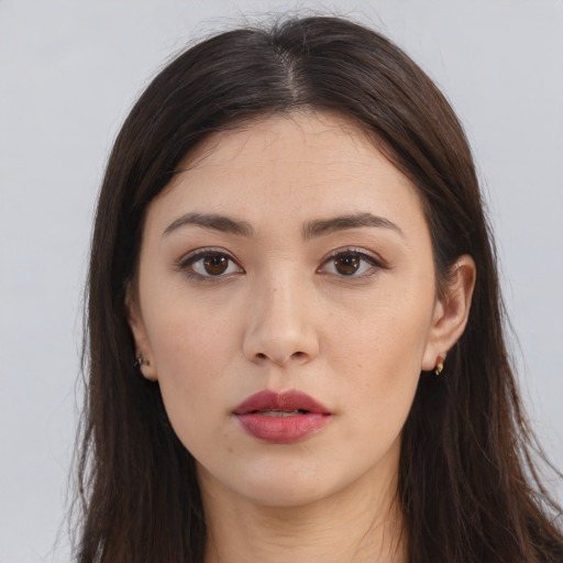 Neutral white young-adult female with long  brown hair and brown eyes