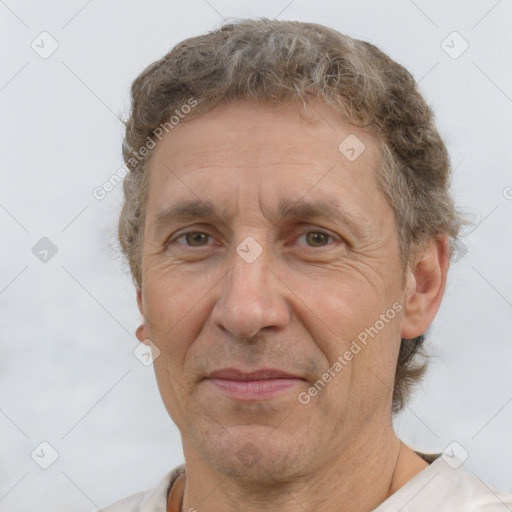 Joyful white middle-aged male with short  brown hair and brown eyes