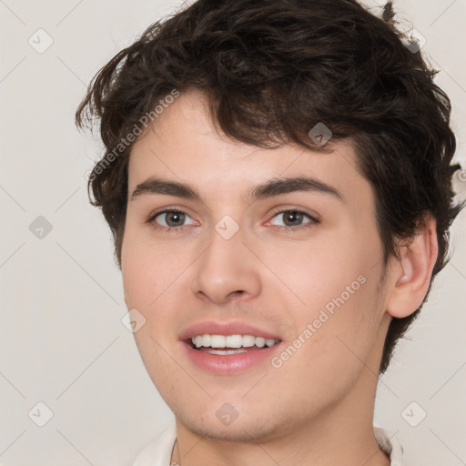 Joyful white young-adult male with medium  brown hair and brown eyes