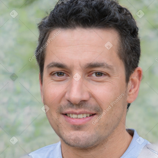 Joyful white young-adult male with short  black hair and brown eyes