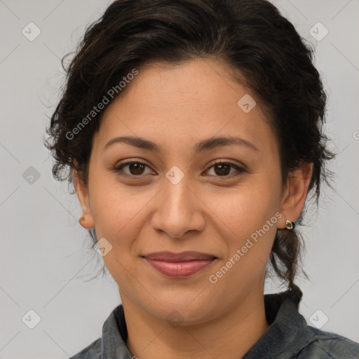 Joyful latino adult female with medium  brown hair and brown eyes