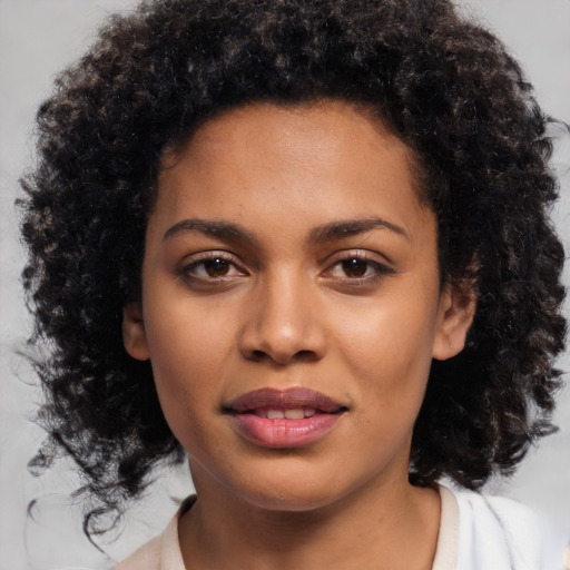 Joyful black young-adult female with medium  black hair and brown eyes