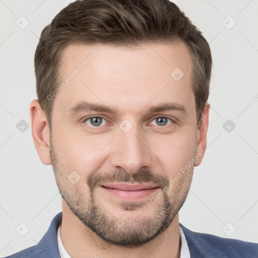 Joyful white young-adult male with short  brown hair and grey eyes