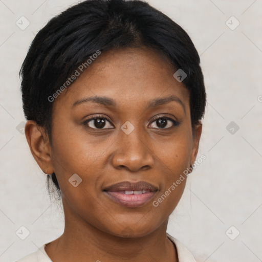 Joyful black young-adult female with short  brown hair and brown eyes