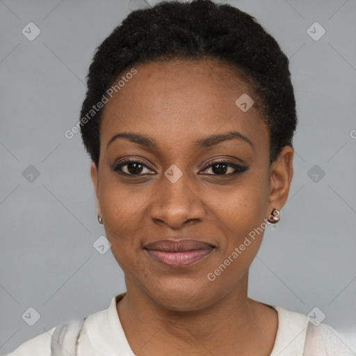 Joyful black young-adult female with short  black hair and brown eyes