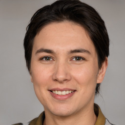 Joyful white adult female with medium  brown hair and brown eyes