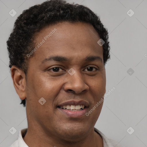 Joyful latino young-adult male with short  brown hair and brown eyes