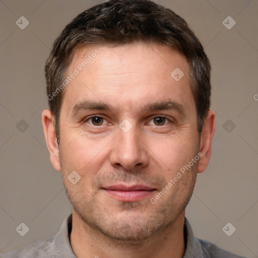 Joyful white adult male with short  brown hair and brown eyes