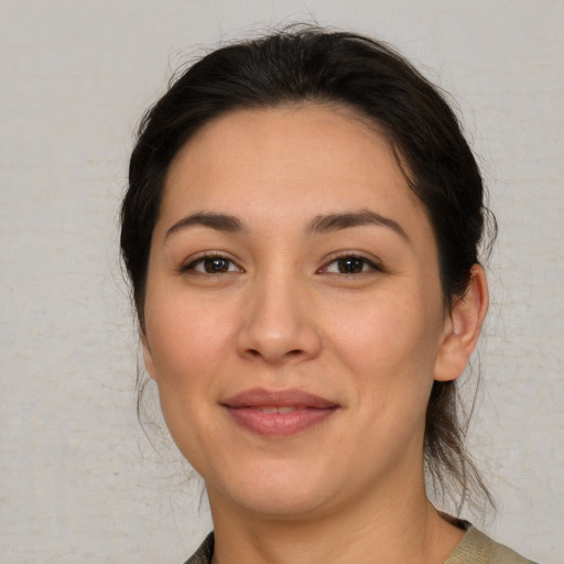 Joyful white young-adult female with medium  brown hair and brown eyes