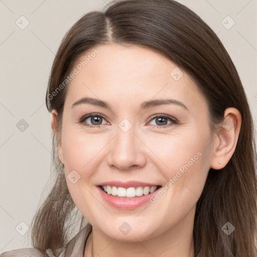 Joyful white young-adult female with long  brown hair and grey eyes