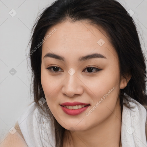 Joyful asian young-adult female with long  brown hair and brown eyes