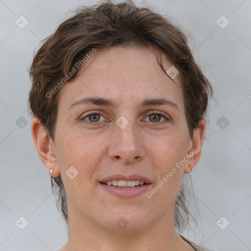 Joyful white adult female with short  brown hair and brown eyes