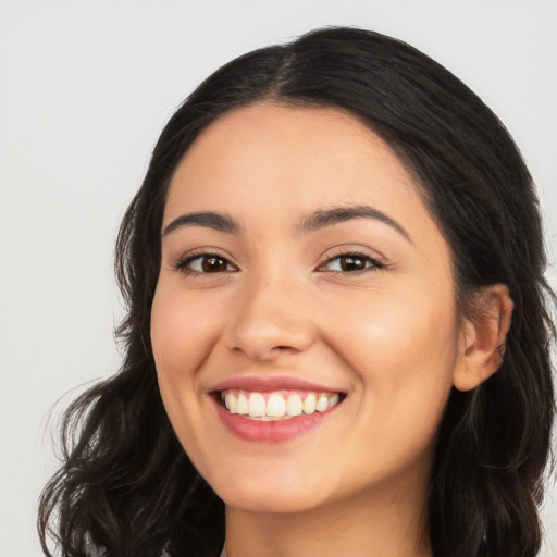 Joyful white young-adult female with long  black hair and brown eyes