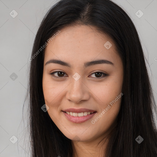 Joyful asian young-adult female with long  brown hair and brown eyes