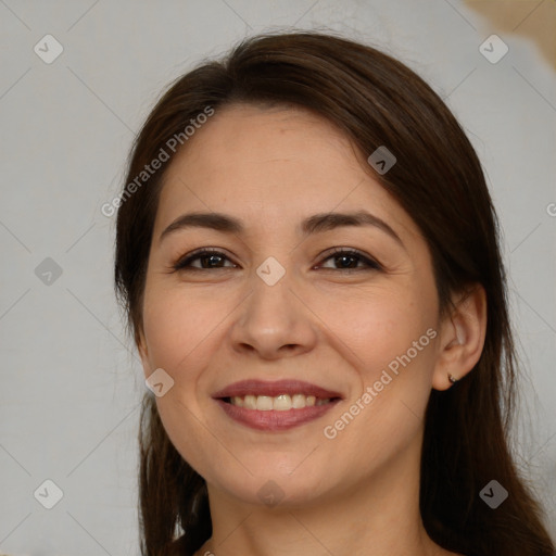 Joyful white young-adult female with long  brown hair and brown eyes