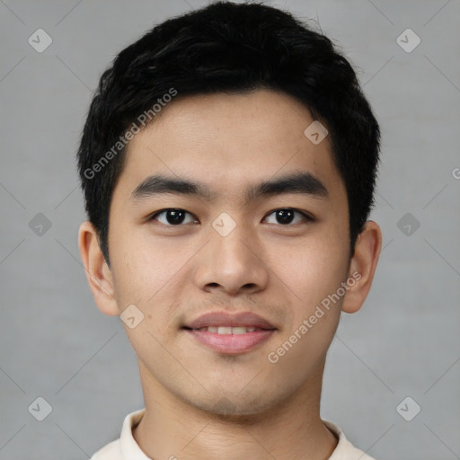Joyful asian young-adult male with short  black hair and brown eyes