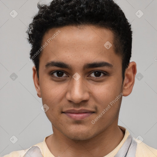 Joyful latino young-adult male with short  brown hair and brown eyes