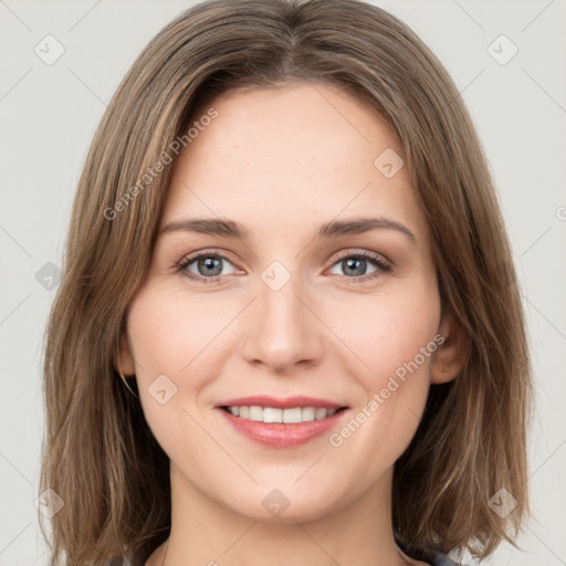 Joyful white young-adult female with long  brown hair and green eyes