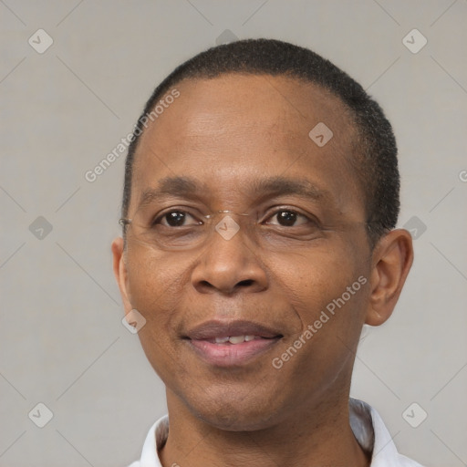 Joyful black adult male with short  brown hair and brown eyes