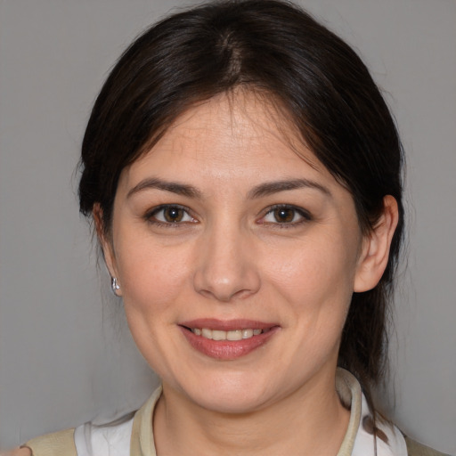 Joyful white young-adult female with medium  brown hair and brown eyes