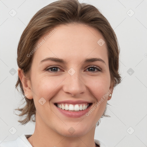 Joyful white young-adult female with medium  brown hair and grey eyes